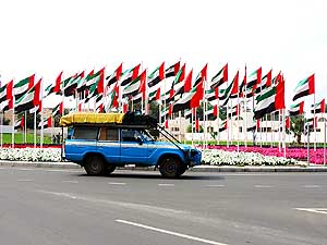United Arab Emirates: UAE flags at a roundabout in Al Ruwais