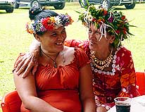 Tahiti/French Polynesia: Tahitiens with fresh traditional flower wreath handmade